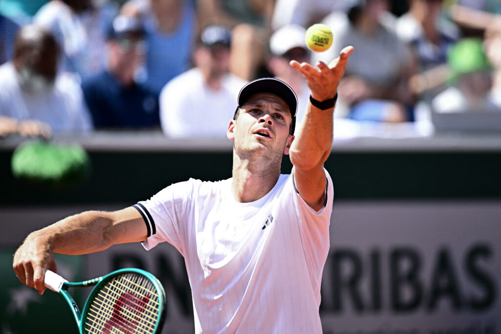 Hubert Hurkacz hits a serve against Frances Tiafoe at Roland Garros in 2026.