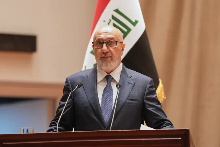 In this photo provided by the Iraqi Parliament Media Office, newly elected president of the Republic of Iraq, Nizar Amidi, speaks inside the Parliament after his election in Baghdad, Iraq, Saturday, April 11, 2026. (Iraqi Parliament Media Office via AP)